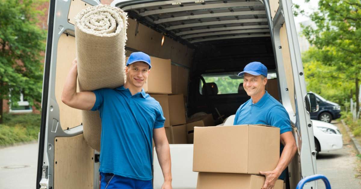 Two-movers-in-Georgetown-holding-boxes