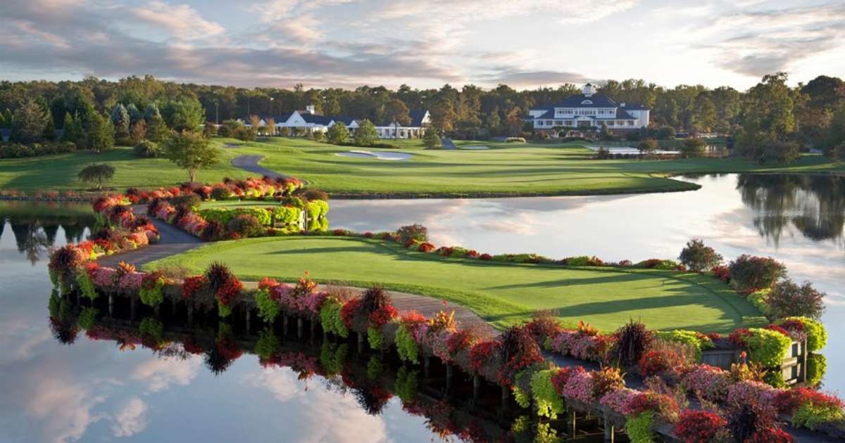 An aerial view of the Baywood Greens golf course on a partly cloudy day