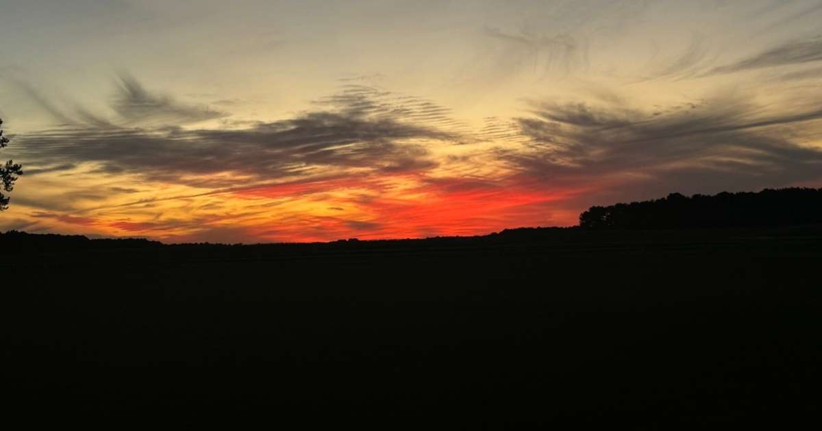 A sunset on a partly cloudy day in Millsboro