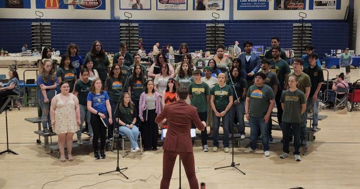 The student choir at Sussex Central High School practicing for a concert