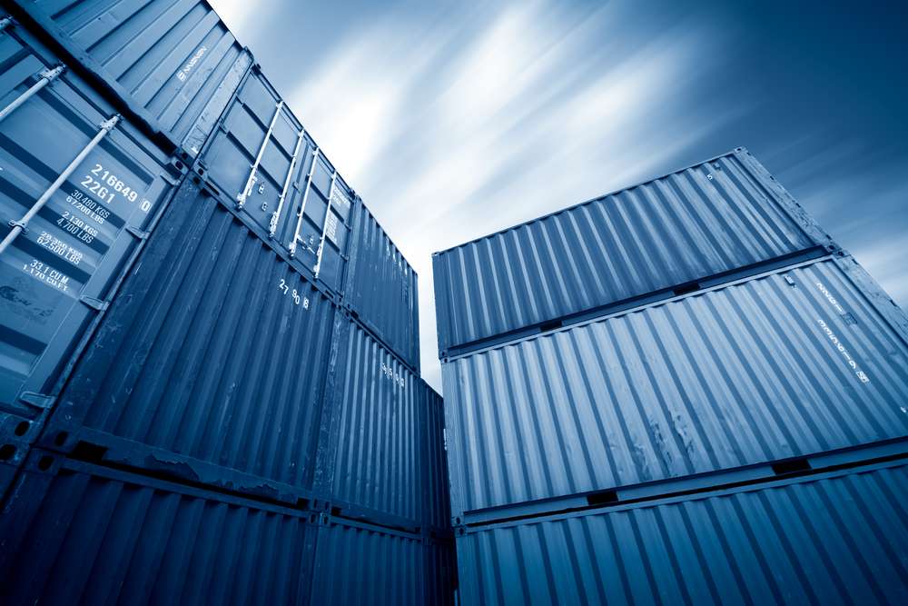 Storage containers being stacked